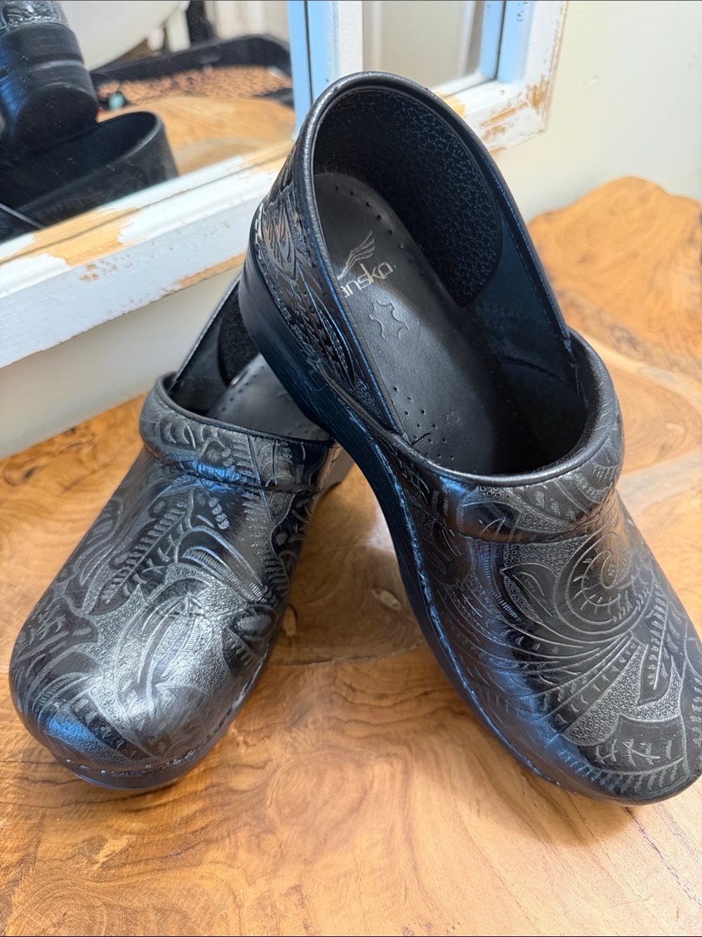 Dansko Black Embossed Floral Leather Clogs